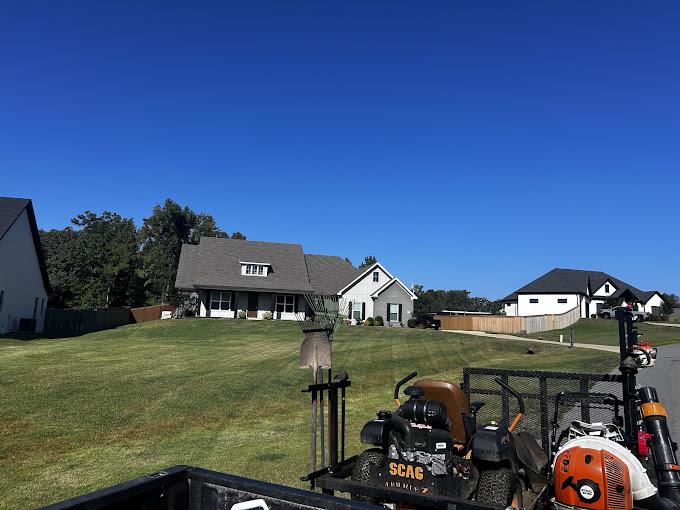 Commercial SCAG mower on a freshly cut backyard lawn